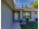 Inviting front porch with decorative plants and stone accents, enhancing curb appeal at 9085 Sw 202Nd Avenue Rd, Dunnellon, FL 34431