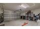 Clean two-car garage with storage, an automatic door opener, and a concrete floor at 9085 Sw 202Nd Avenue Rd, Dunnellon, FL 34431