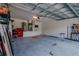 Large two-car garage with abundant storage and a clean concrete floor at 9085 Sw 202Nd Avenue Rd, Dunnellon, FL 34431