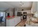 Spacious kitchen with large island, stainless appliances, and white cabinetry at 9085 Sw 202Nd Avenue Rd, Dunnellon, FL 34431