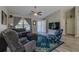 Inviting living room featuring neutral walls, wood floors, and an area rug at 9085 Sw 202Nd Avenue Rd, Dunnellon, FL 34431