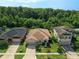 Aerial view of home with lush landscaping and tree lined perimeter at 2960 Boating Blvd, Kissimmee, FL 34746