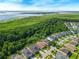 Aerial view showcasing a neighborhood nestled amidst lush greenery, featuring well-maintained homes and scenic surroundings at 2960 Boating Blvd, Kissimmee, FL 34746