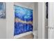 Well-lit bathroom with blue decorative shower curtain at 2960 Boating Blvd, Kissimmee, FL 34746