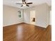 Spacious bedroom with wood flooring, neutral paint, a ceiling fan, and natural light at 2960 Boating Blvd, Kissimmee, FL 34746