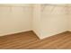 Walk-in closet featuring wire shelving and wood-look flooring, offering ample storage space at 2960 Boating Blvd, Kissimmee, FL 34746