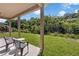 Outdoor seating provides a relaxing view of the lush backyard, offering a peaceful retreat at 2960 Boating Blvd, Kissimmee, FL 34746