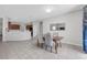 Charming dining area with a modern table setting, seamlessly connected to the kitchen at 2960 Boating Blvd, Kissimmee, FL 34746