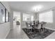 Spacious dining room with a dark wood table and seating, with an open view to the living area at 2960 Boating Blvd, Kissimmee, FL 34746