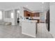 Modern kitchen featuring dark cabinets, quartz countertops, and breakfast bar seating at 2960 Boating Blvd, Kissimmee, FL 34746