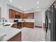 Well-lit kitchen with dark cabinets, white countertops, and modern black appliances at 2960 Boating Blvd, Kissimmee, FL 34746