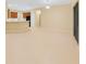 Open floor plan with tile flooring, seamlessly connecting the kitchen and living spaces at 2960 Boating Blvd, Kissimmee, FL 34746