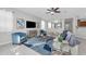 Cozy living room featuring stylish furniture, neutral tones, and an open view of the dining area at 2960 Boating Blvd, Kissimmee, FL 34746
