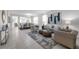 Elegant living room and dining room featuring neutral tones, tile flooring, and lots of natural light at 2960 Boating Blvd, Kissimmee, FL 34746