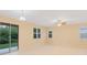 A spacious living area with sliding glass doors leading to the outdoors at 2960 Boating Blvd, Kissimmee, FL 34746