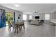 Open-concept living space with dining area, neutral colors, and lots of natural light at 2960 Boating Blvd, Kissimmee, FL 34746