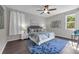 Cozy bedroom with large bed, a plush rug, and great natural lighting at 2960 Boating Blvd, Kissimmee, FL 34746