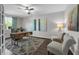 Inviting home office featuring modern decor, wood-look floors, natural light, and a stylish ceiling fan at 2960 Boating Blvd, Kissimmee, FL 34746