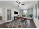 This office features hardwood floors, natural light from the window, and a ceiling fan at 2960 Boating Blvd, Kissimmee, FL 34746