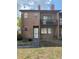 Brick condo with a small balcony and an unfinished front yard at 5032 Downing St # 10, Orlando, FL 32839