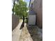 A backyard shed next to a townhome behind a wood fence at 5032 Downing St # 10, Orlando, FL 32839