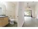 This is a full bathroom that leads into the living room and includes a shower-tub combo at 777 Summit Greens Blvd, Clermont, FL 34711