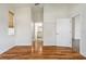 Bright bedroom boasts wood floors and a view leading to the bathroom at 777 Summit Greens Blvd, Clermont, FL 34711