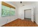 The bedroom has hardwood floors and the closet can be accessed with an open door at 777 Summit Greens Blvd, Clermont, FL 34711