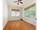 This bedroom is filled with natural light thanks to the large windows with blinds at 777 Summit Greens Blvd, Clermont, FL 34711