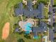 The clubhouse features a pool, putting green, sand trap, shuffleboard and is surrounded by lush landscaping at 777 Summit Greens Blvd, Clermont, FL 34711