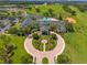 Aerial view of the clubhouse, highlighting its manicured grounds, pool, and prime location on the golf course at 777 Summit Greens Blvd, Clermont, FL 34711