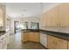 Bright kitchen featuring light cabinets, stainless steel appliances and sleek countertops, perfect for modern living at 777 Summit Greens Blvd, Clermont, FL 34711