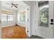 The living room and bedroom have hard wood floors and natural light comes in through the windows at 777 Summit Greens Blvd, Clermont, FL 34711