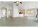 Bright, open living space featuring neutral tile flooring, high ceilings, and abundant natural light at 777 Summit Greens Blvd, Clermont, FL 34711