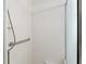 Shower with white tiled walls and glass doors features a convenient grab bar at 777 Summit Greens Blvd, Clermont, FL 34711
