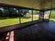 View from screen enclosed porch showcasing backyard and small shed, adding to outdoor living space at 15 Monroe Ave, Debary, FL 32713