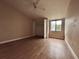 Bedroom featuring hardwood floors, closet, ceiling fan, window, and neutral walls at 1925 Laredo Dr, Deltona, FL 32738