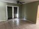 Living room with tile flooring and sliding glass doors to the back at 116 Wild Holly Ln, Longwood, FL 32779