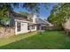 Spacious backyard with lawn, patio, and partial fence at 1839 Cranberry Isles Way, Apopka, FL 32712
