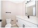 Updated bathroom with modern fixtures, white cabinets and quartz countertop at 1839 Cranberry Isles Way, Apopka, FL 32712