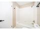 Bathroom featuring tub and toilet, with tiled walls and floors at 1839 Cranberry Isles Way, Apopka, FL 32712