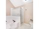 Bathroom featuring a tub, frosted glass shower, and tile flooring at 1839 Cranberry Isles Way, Apopka, FL 32712