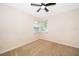 Neutral bedroom with a ceiling fan, carpet flooring, and two windows at 1839 Cranberry Isles Way, Apopka, FL 32712