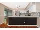 Updated kitchen featuring stainless steel appliances and geometric tile backsplash at 1839 Cranberry Isles Way, Apopka, FL 32712