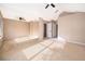 Large main bedroom with neutral carpeting, ceiling fan, and walk-in closet at 1839 Cranberry Isles Way, Apopka, FL 32712