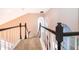 Bright staircase with views from large arched windows at 1839 Cranberry Isles Way, Apopka, FL 32712