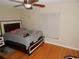 Bedroom with hardwood floors, ceiling fan and a window for natural light at 3509 Lisa Ln, Lakeland, FL 33801