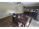 Open concept dining room with ceiling fan, adjacent to the kitchen with laminate flooring at 3509 Lisa Ln, Lakeland, FL 33801