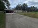 Charming home with a spacious driveway and a convenient carport for parking at 3509 Lisa Ln, Lakeland, FL 33801