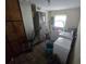 Practical laundry room equipped with washer, dryer, water heater, and ample storage space at 3509 Lisa Ln, Lakeland, FL 33801